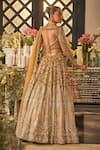 Isa By Dolly Wahal_Gold Net Sequins, Crystals, Beads, Embroidery Embellished Bridal Lehenga Set _at_Aza_Fashions