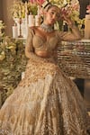 Buy_Isa By Dolly Wahal_Gold Net Sequins, Crystals, Beads, Embroidery Embellished Bridal Lehenga Set _at_Aza_Fashions