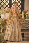 Shop_Isa By Dolly Wahal_Gold Net Sequins, Crystals, Beads, Embroidery Embellished Bridal Lehenga Set _at_Aza_Fashions