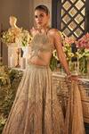 Buy_Isa By Dolly Wahal_Gold Net Sequins, Crystals, Embroidery Halter Neck Zara Embellished Lehenga Set _Online_at_Aza_Fashions