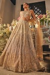 Buy_Isa By Dolly Wahal_Gold Net Sequins, Crystals, Embroidery Halter Neck Zara Embellished Lehenga Set _at_Aza_Fashions