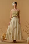 Abstract By Megha Jain Madaan_Gold Georgette, Tissue Sequins Bandeau Neck Embellished Ruched Top With Skirt _at_Aza_Fashions