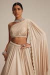 Shop_Vvani By Vani Vats_Beige Satin Pearls, Tassels One Shoulder Light Lehenga Set _Online_at_Aza_Fashions