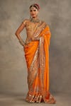 Shop_The Royaleum_Orange Silk Embroidery, Sequins, Zari, Mirrors V-neck Ishmira Saree _at_Aza_Fashions