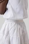 Reistor White Cotton Embroidery Split V-neck Tiered Cutwork Short Dress Online at Aza Fashions Reistor_White Cotton Embroidery Split V-neck Tiered Cutwork Short Dress _Online_at_Aza_Fashions