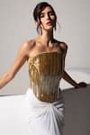 Vesture Gold Lycra, Mesh Zari, Beads Bandeau Neck Radiance Corset And White Draped Skirt Online at Aza Fashions Vesture_Gold Lycra, Mesh Zari, Beads Bandeau Neck Radiance Corset And White Draped Skirt _Online_at_Aza_Fashions