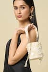 Buy_The Purple Sack_Off White Beads, Sequins, Fabric Flowers Pearl And Embellished Floral Potli Bag _at_Aza_Fashions