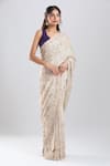 Buy_Azeera_Ivory Tissue Embroidery, Sequins, Zari Saree With Unstitched Blouse Piece _at_Aza_Fashions