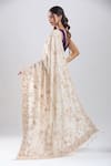 Shop_Azeera_Ivory Tissue Embroidery, Sequins, Zari Saree With Unstitched Blouse Piece _at_Aza_Fashions