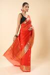 Buy_Mint N Oranges_Orange Organza Zari Floral Woven Saree With Unstitched Blouse Piece _Online_at_Aza_Fashions