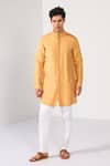 Buy_Kalpana Naik_Mustard Bemberg, Silk Pintuck Sunshine Kurta Set _at_Aza_Fashions