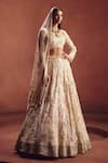 Buy Awigna Ivory Net Embroidery, Beads, Sequins, Zari Square Bridal Embellished Lehenga Set at Aza Fashions Buy_Awigna_Ivory Net Embroidery, Beads, Sequins, Zari Square Bridal Embellished Lehenga Set _at_Aza_Fashions