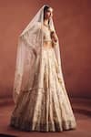 Awigna Ivory Net Embroidery, Beads, Sequins, Zari Square Bridal Embellished Lehenga Set Online at Aza Fashions Awigna_Ivory Net Embroidery, Beads, Sequins, Zari Square Bridal Embellished Lehenga Set _Online_at_Aza_Fashions