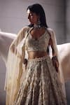 Awigna Ivory Net Embroidery, Beads, Sequins V-neck Bridal Lehenga Set Online at Aza Fashions Awigna_Ivory Net Embroidery, Beads, Sequins V-neck Bridal Lehenga Set _Online_at_Aza_Fashions