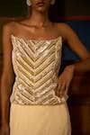 Saangi_Ivory Crepe, Viscose Sequins, Zari, Embroidery Ember Sculpted Corset With Skirt _at_Aza_Fashions