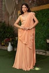 Buy_Nidhi Kejriwal_Peach Georgette Pearls, Beads, Sequins Embroidered Pre-draped Saree With Blouse _at_Aza_Fashions