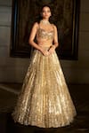 Buy_Seema Gujral_Gold Net Sequins, Crystals, Tassels, Embroidery Sweetheart Neck Lehenga Set _at_Aza_Fashions