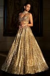 Buy_Seema Gujral_Gold Net Sequins, Crystals, Tassels, Embroidery Sweetheart Neck Lehenga Set _Online_at_Aza_Fashions