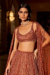 Buy_Seema Gujral_Orange Net Crystals, Sequins, Beads, Tassels, Embroidery Copper Lehenga Set _Online_at_Aza_Fashions