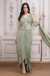 Buy_Mandira Wirk Resort_Green Lycra Sequins, Beads, Metallic Embellished Pre-draped Saree With Blouse _at_Aza_Fashions