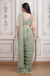 Shop_Mandira Wirk Resort_Green Lycra Sequins, Beads, Metallic Embellished Pre-draped Saree With Blouse _at_Aza_Fashions