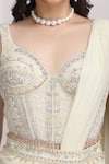 Mandira Wirk Resort_Ivory Jersey Sequins, Beads, Embellished Corset Blouse And Pre-draped Saree Set _at_Aza_Fashions