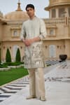 Buy_Tarun Tahiliani_Beige Cotton, Jacquard, Suiting Pichwai Print Kurta And Flared Trouser Set _at_Aza_Fashions