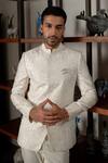 Mishru_Ivory Chanderi, Cotton, Lycra Embroidery Khari Jodhpuri Jacket Set _at_Aza_Fashions