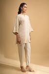 Naintara Bajaj Beige Linen Embroidery Split V-neck Kurta And Pant Set at Aza Fashions Naintara Bajaj_Beige Linen Embroidery Split V-neck Kurta And Pant Set _at_Aza_Fashions