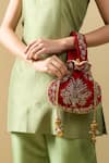 Shop_Nazaakat By Samara Singh_Red Embroidery, Zari, Pearls, Tassels Raas Velvet Silk Potli Bag _Online_at_Aza_Fashions