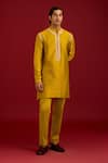 Buy_Devnaagri_Mustard Chanderi, Cotton, Lycra Embroidery Bandhej Kurta And Pant Set _at_Aza_Fashions