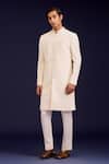 Devnaagri_Ivory Cotton, Silk, Lycra Embroidery Pintuck Pattern Sherwani And Pant Set _Online_at_Aza_Fashions