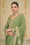 Shop_Arpita Mehta_Olive Green Georgette Embroidery, Mirrors, Sequins Scoop Shand Star Saree Set _Online_at_Aza_Fashions
