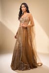 Seema Gujral_Gold Net Sequins, Beads Sweetheart Neck Embroidered Mermaid Lehenga Set _at_Aza_Fashions