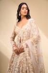 Seema Gujral_Beige Net Pearls, Embroidery, Zari V-neck Jacket Lehenga Set _at_Aza_Fashions