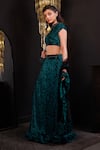 Hoity Moppet_Emerald Green Net Stones, Embroidery, Beads, Ruffles Embellished Lehenga Set _at_Aza_Fashions