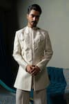 Shop_Runit Gupta_Ivory Silk Piping Dusty Flap Sherwani Set _Online_at_Aza_Fashions