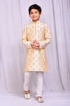 Buy_Petite Pomme_Beige Silk Embroidery Bloom Cluster Kurta With Churidar _at_Aza_Fashions
