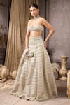 Shop_Rocky Star_Ivory Net, Silk Sequins, Beads, Ruffles Embellished Blouse And Tiered Lehenga Set _Online_at_Aza_Fashions
