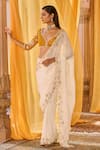 Zoon_Off White Chiffon, Net Embroidery, Sequins V-neck Aari Saree With Blouse _at_Aza_Fashions