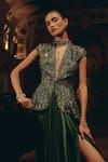 Adaara Couture_Emerald Green Net Sequins, Beads, Embellished Peplum Top And Pleated Skirt Set _at_Aza_Fashions