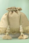 Shop_Amyra_Beige Tassels, Beads, Metallic Thread Nira Katan Silk Woven Potli Bag _Online_at_Aza_Fashions
