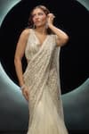 Shop_Couture By Niharika_Ivory Net Embroidery, Sequins V-neck Alvara Pre-draped Saree With Blouse _at_Aza_Fashions