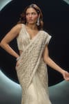 Couture By Niharika_Ivory Net Embroidery, Sequins V-neck Alvara Pre-draped Saree With Blouse _at_Aza_Fashions