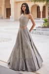 Charu And Vasundhara_Silver Tissue Embroidery, Sequins Krystabelle Embellished Corset Lehenga Set _at_Aza_Fashions