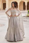 Buy_Charu And Vasundhara_Silver Tissue Embroidery, Sequins Krystabelle Embellished Corset Lehenga Set _at_Aza_Fashions