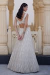 Shop_Charu And Vasundhara_Ivory Net Sequins, Beads, Embroidery Kirsten Embellished Lehenga And Blouse Set _at_Aza_Fashions