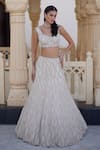 Buy_Charu And Vasundhara_Ivory Net Sequins, Beads, Embroidery Kirsten Embellished Lehenga And Blouse Set _at_Aza_Fashions