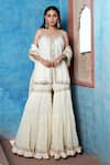 Buy Nazar By Indu Ivory Cotton Mirrors, Embroidery, Gota Patti Scoop Strappy Kurta Sharara Set at Aza Fashions Buy_Nazar By Indu_Ivory Cotton Mirrors, Embroidery, Gota Patti Scoop Strappy Kurta Sharara Set _at_Aza_Fashions