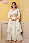 Buy Nazar By Indu Ivory Cotton Embroidery, Sequins, Tassels Blouse And Motif Flared Lehenga Set at Aza Fashions Buy_Nazar By Indu_Ivory Cotton Embroidery, Sequins, Tassels Blouse And Motif Flared Lehenga Set _at_Aza_Fashions